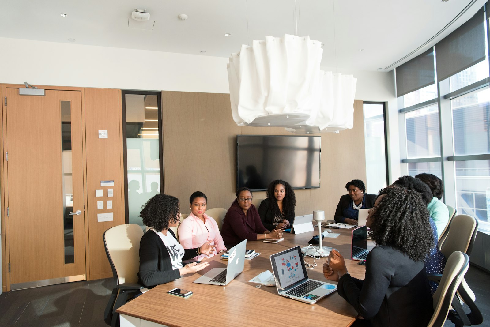 African professionals collaborating in a modern boardroom meeting